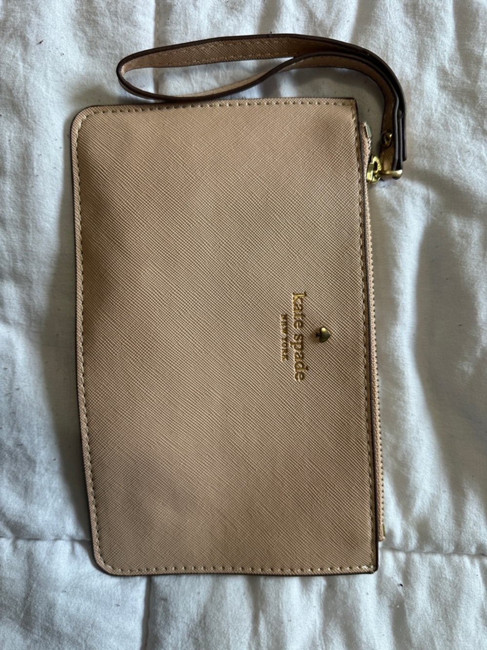 kate spade beige saffiano wristlet with gold logo